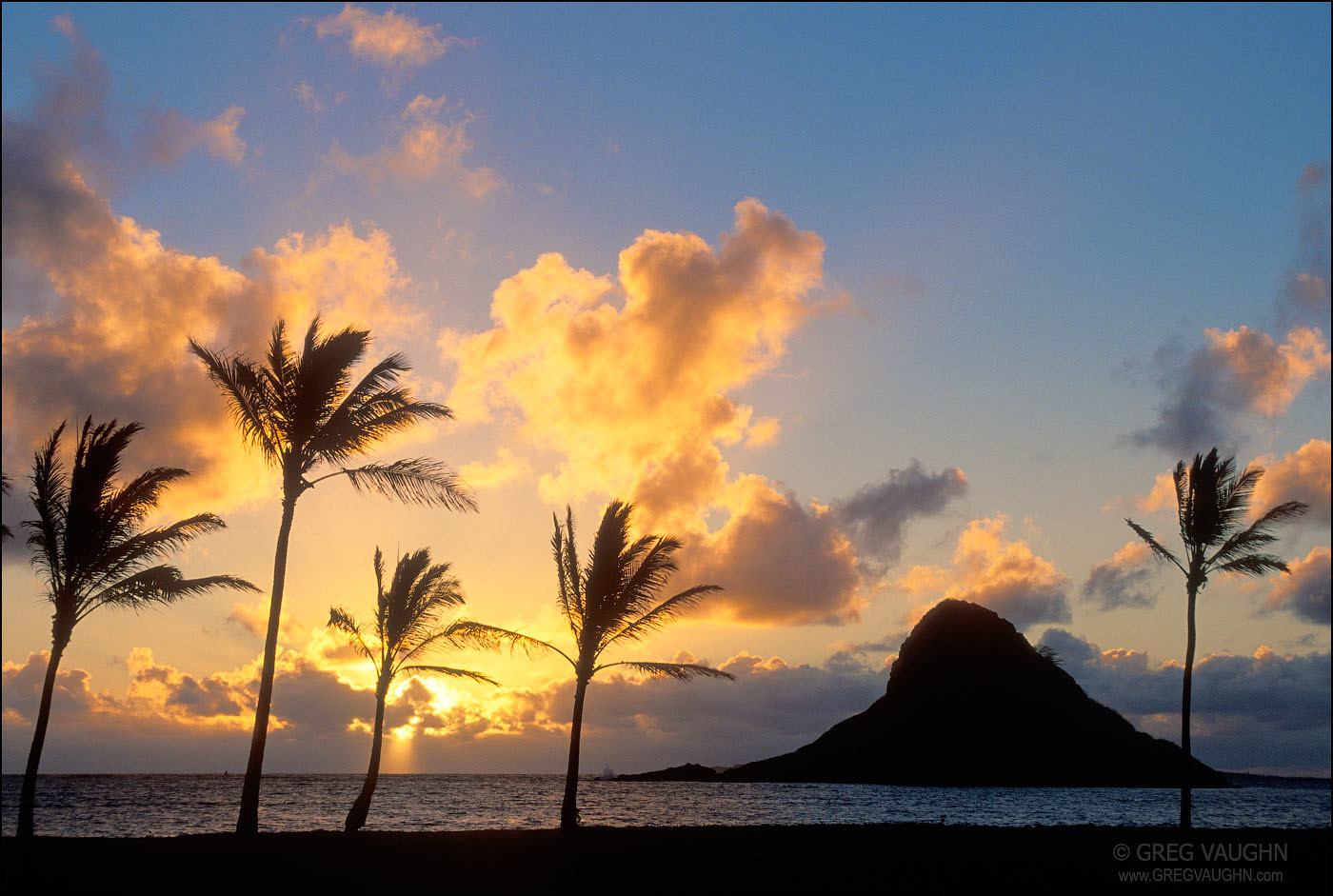 Sunrise and Mokoli'i Island, Kualoa Regional Park, Windward Oahu, Hawaii.