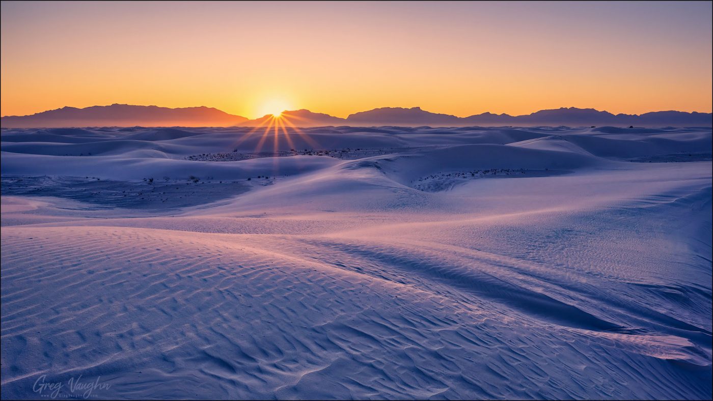 Sunset over the San Andres Mountains and sand dunes at White Sands National Park, New Mexico, USA.